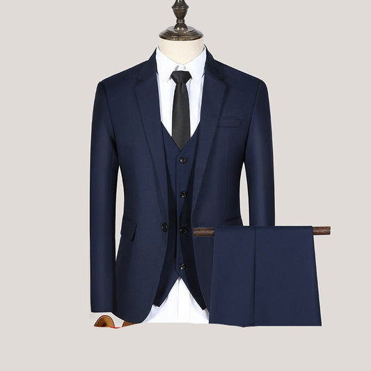 A navy blue three-piece suit with a one-button jacket, vest, and trousers, displayed on a mannequin.