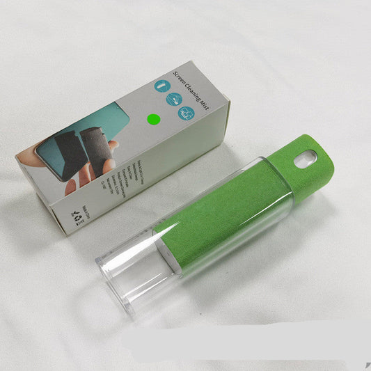 Green cleaning brush with packaging on a white background