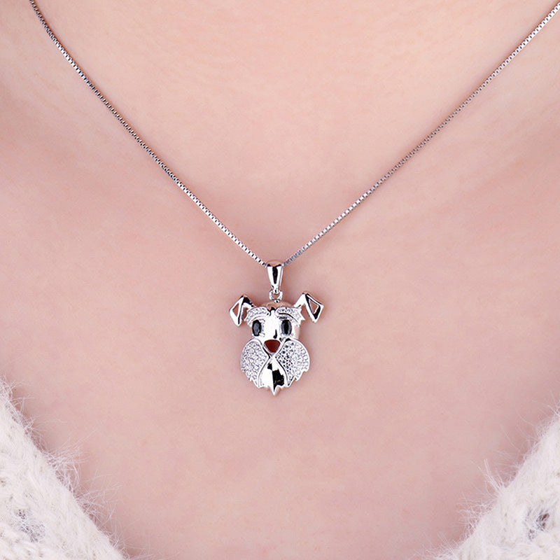 Silver koala pendant necklace on a pink background