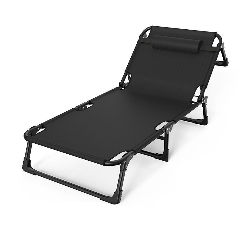 Black folding lounge chair with adjustable headrest on a white background