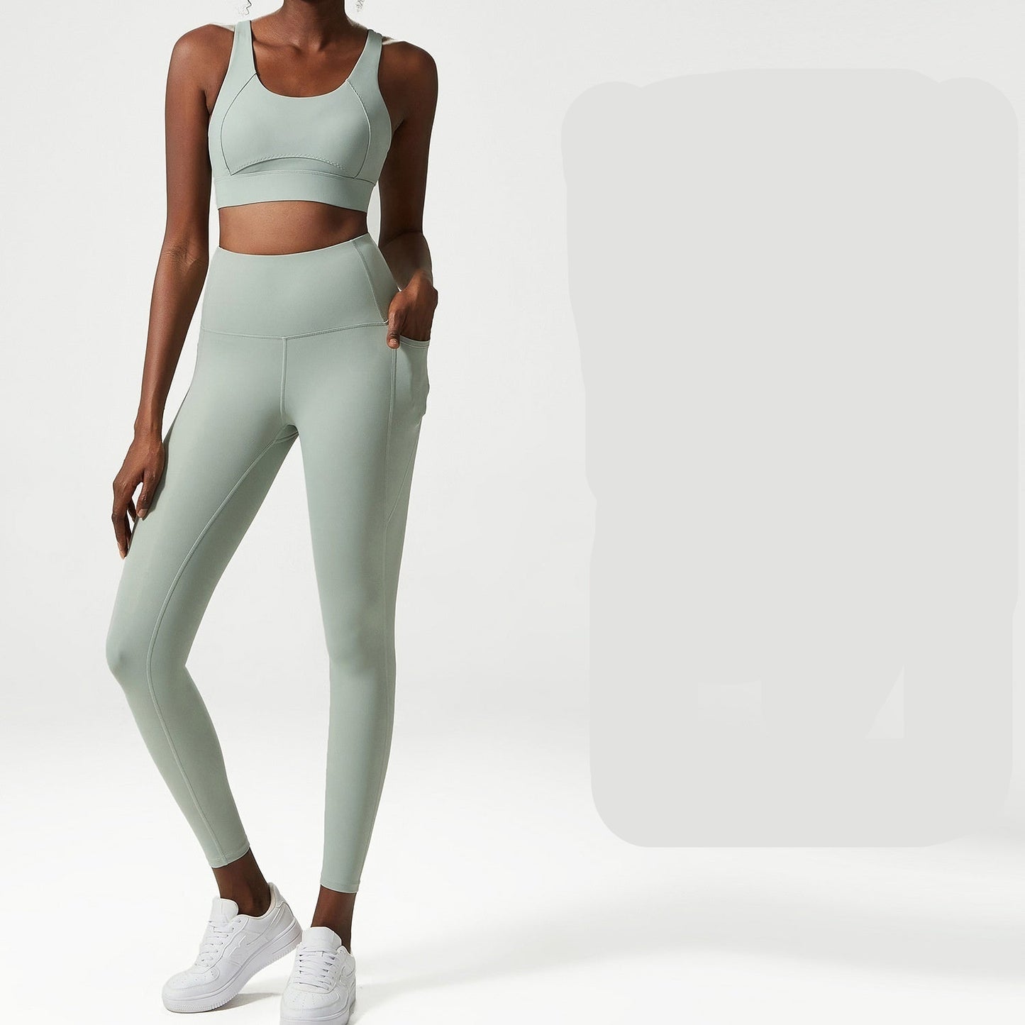 Woman wearing a light green sports bra and leggings set with 'Wen Yulu' branding.