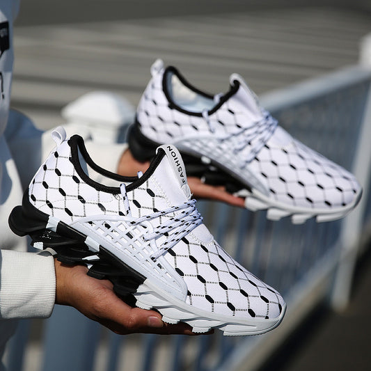 White and black sneaker with a unique pattern held by a person, blurred background