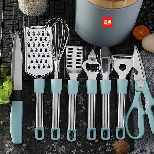 Set of kitchen utensils with blue handles on a dark surface.