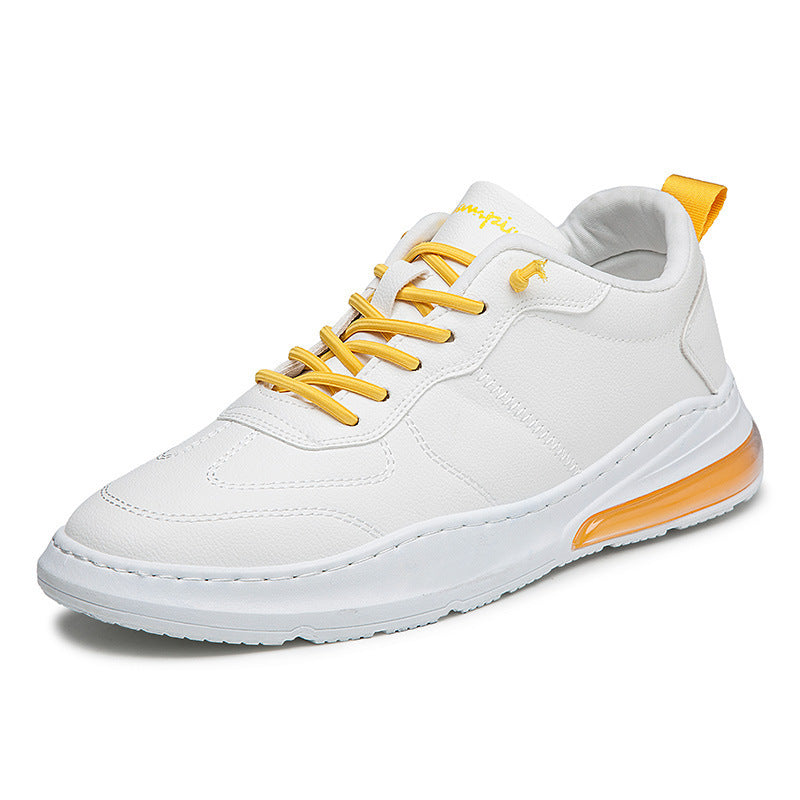 White sneaker with yellow laces and sole on a white background