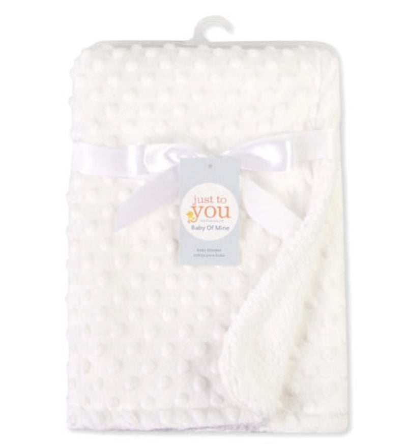 White baby blanket with 'just to you' label on a white background