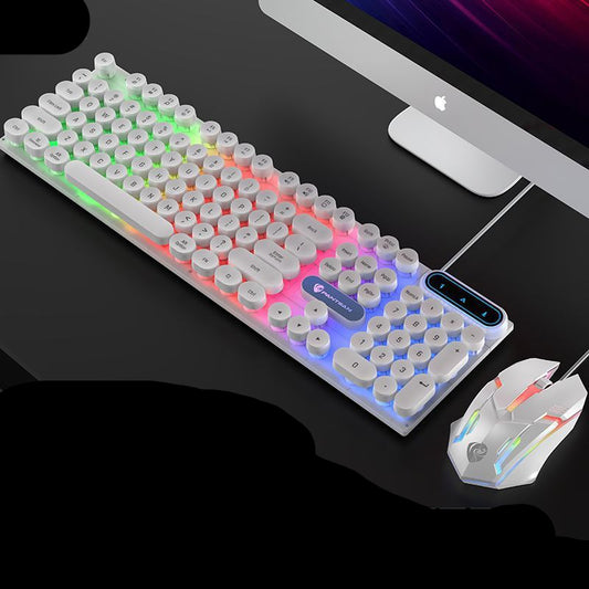 Keyboard and mouse set with retro punk keycap design in front of a computer monitor.