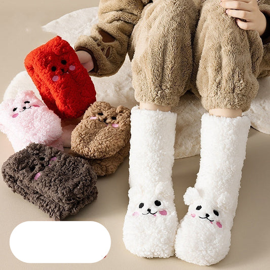 Plush animal-themed socks with cartoon faces on a neutral background