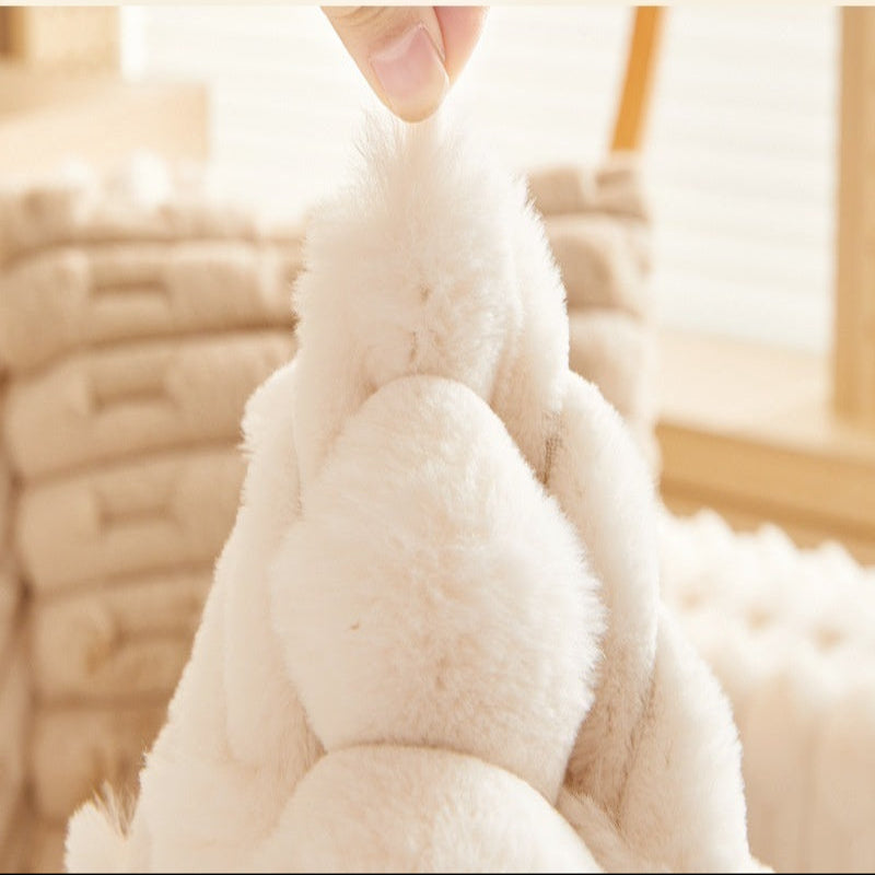 Close-up of a white plush toy with text about winter inspiration and product features.