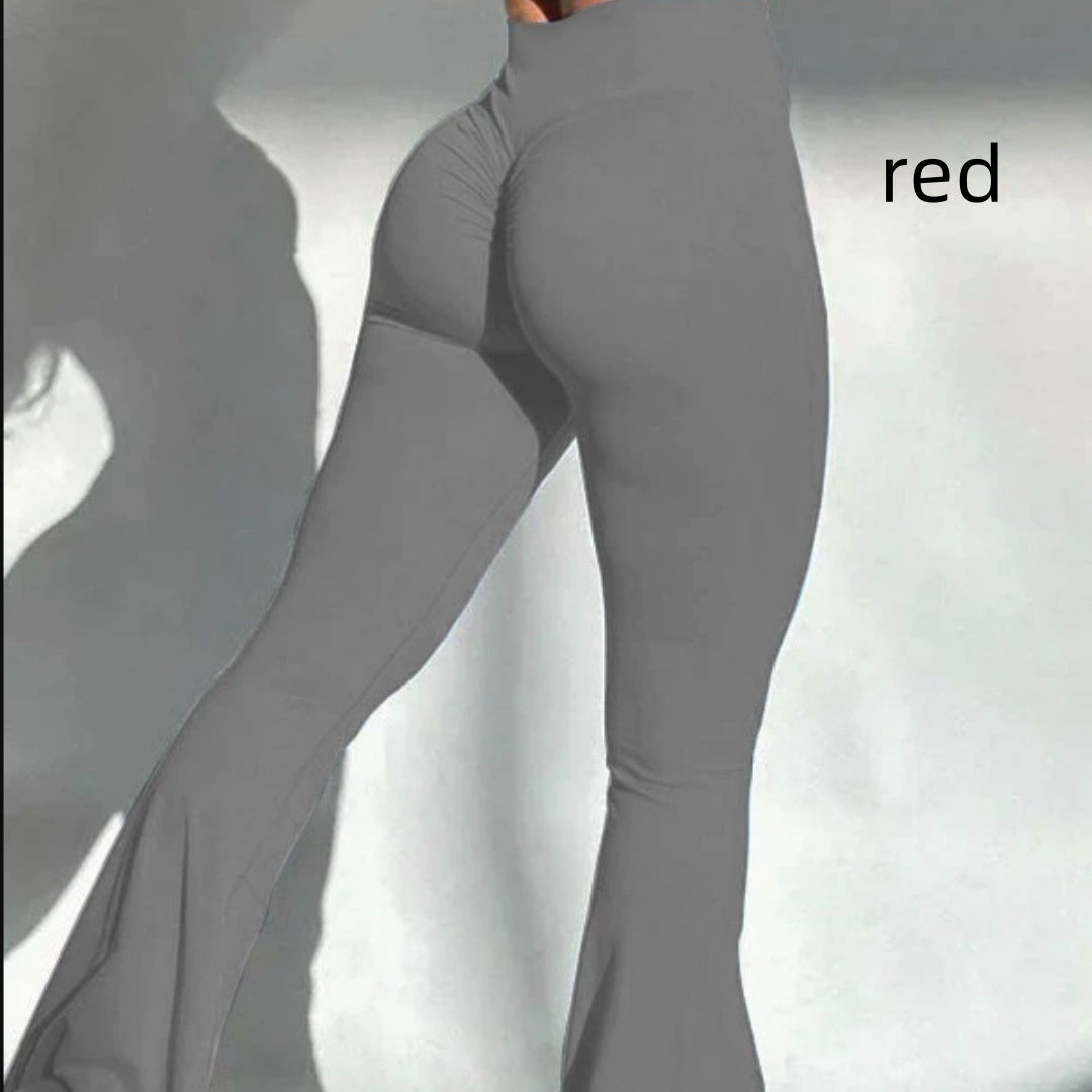 A pair of black, tight-fitting sports pants worn by a model.