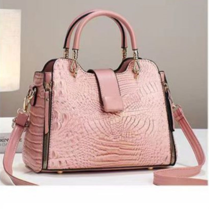 Pink textured handbag on a light background