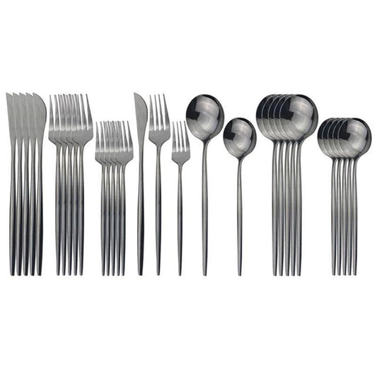 A set of stainless steel flatware including table knives, table forks, table spoons, dessert forks, and dessert spoons, presented in parallel rows.