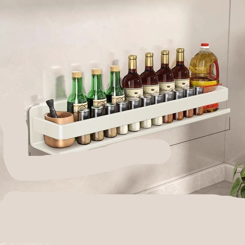Wall-mounted storage rack with bottles and measurements on a neutral background