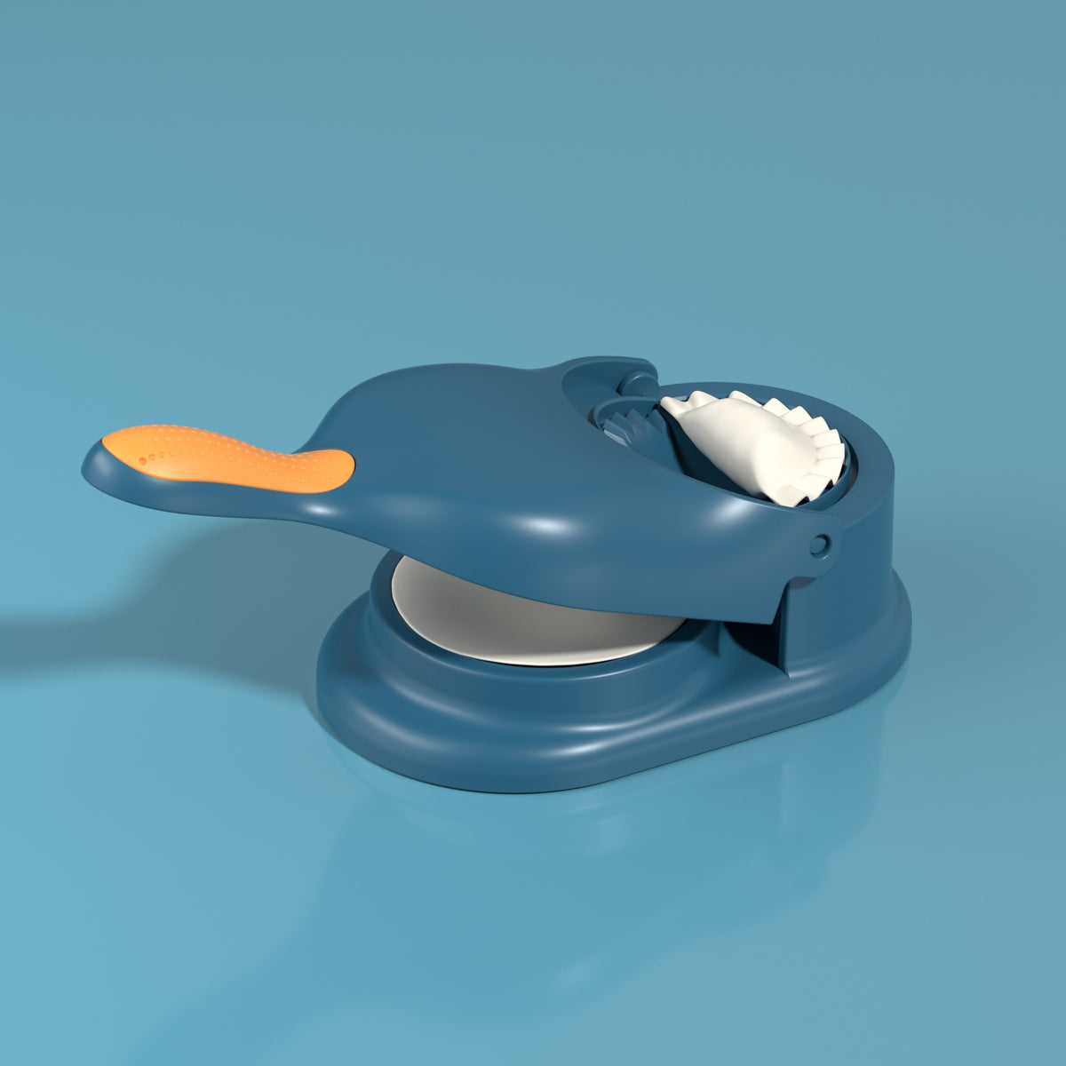 Blue cookie press with orange handle on a blue background