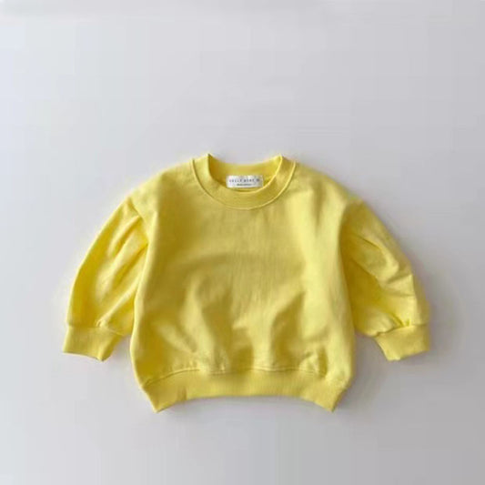 Yellow sweatshirt on a light gray background