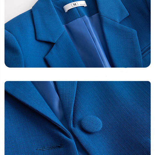 Blue blazer with a close-up of a button and label on a white background