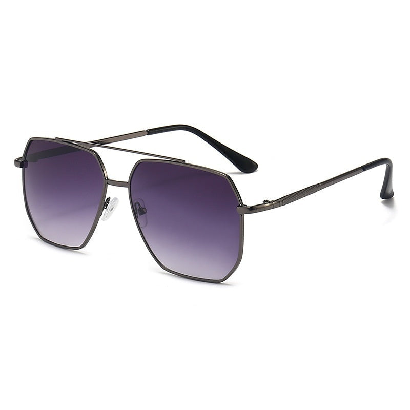 A pair of aviator style sunglasses with a double beam design, featuring dark lenses and a metallic frame.