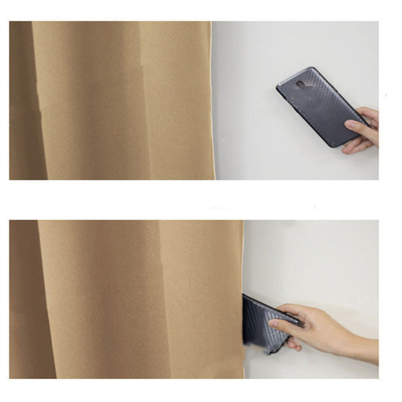 Phone case being held over a white surface with a brown fabric background