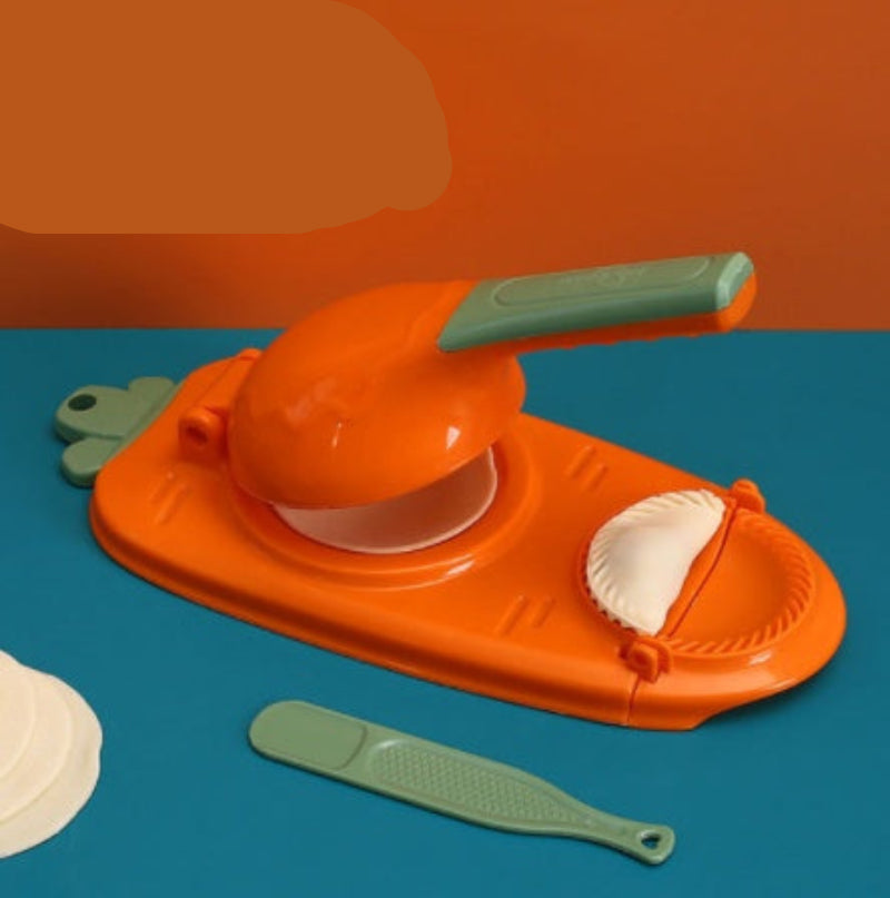Orange and green kitchen tool on a blue surface with an orange background