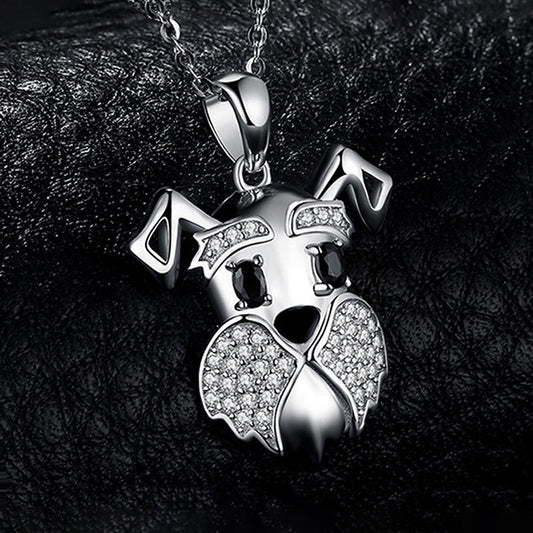 Silver pendant shaped like a fox with gemstones on a dark background
