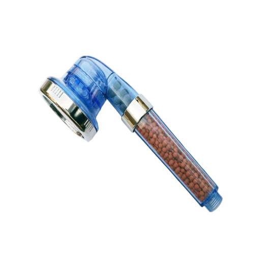 Blue shower head with brown beads on a white background