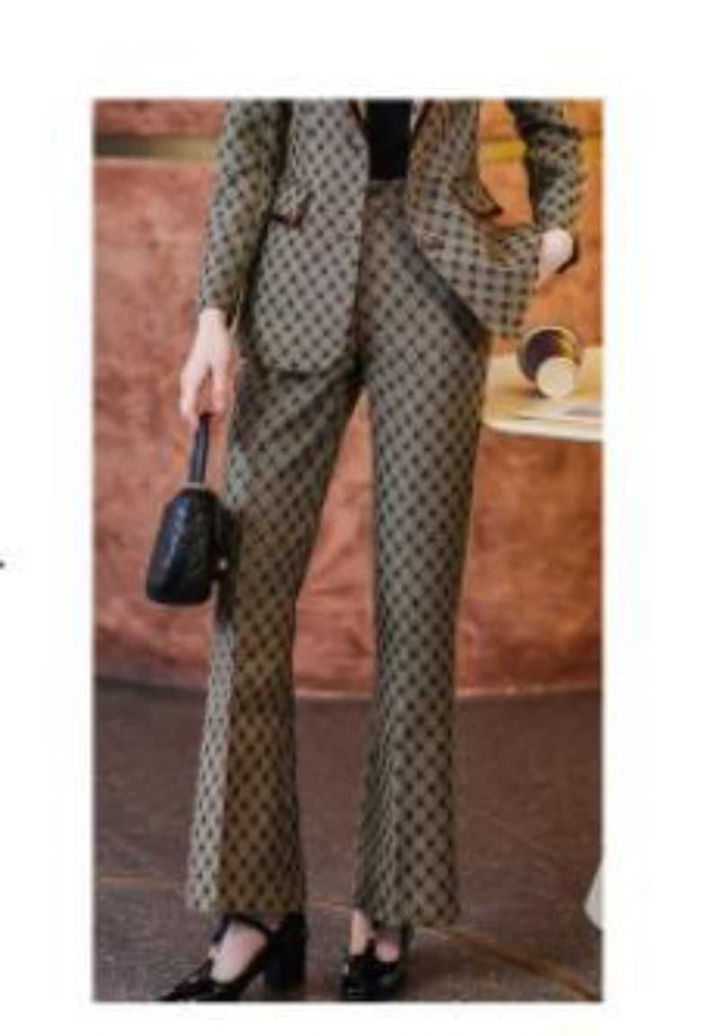 Person wearing a patterned outfit with a handbag in an indoor setting