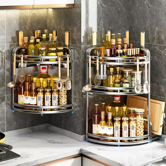 Two corner kitchen storage racks filled with bottles and kitchen utensils on a marble countertop.