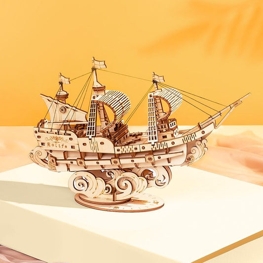 Wooden ship model on a beige surface with a warm gradient background
