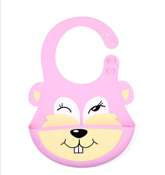 Pink silicone bib with cartoon face design on a white background