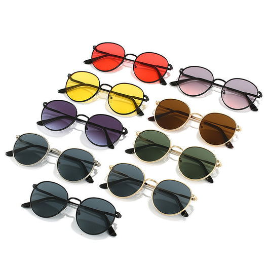 Collection of colorful round sunglasses on a white background