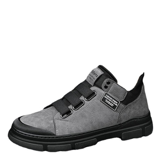 Gray sneaker with black accents on a white background