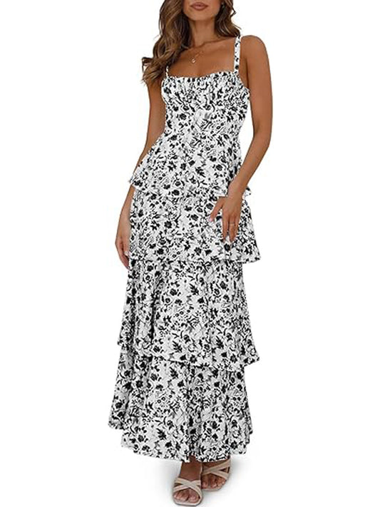 Woman wearing a black and white floral dress on a white background