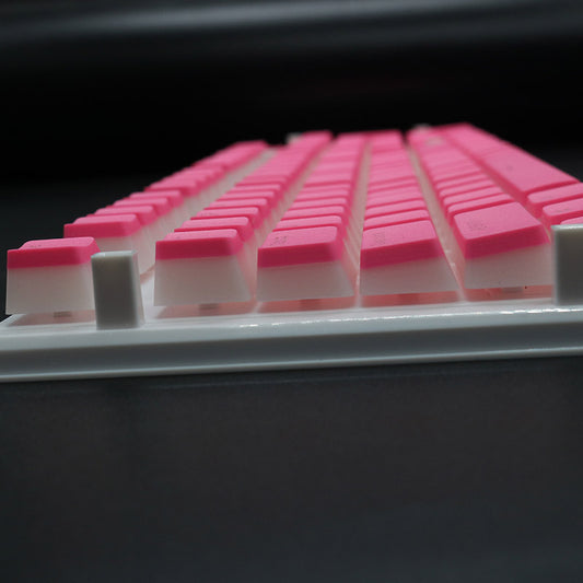 Close-up of pink keyboard keys on a black background