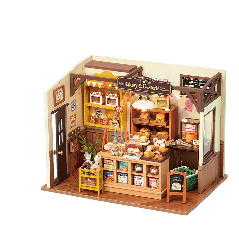 Model of a bakery with miniature items and dimensions labeled
