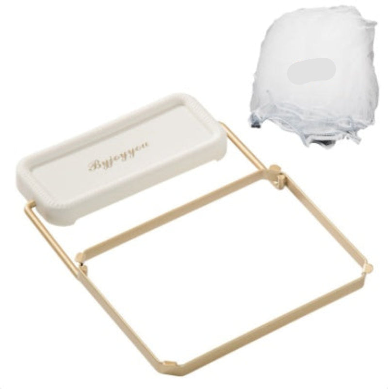 White tray with gold frame and white cloths on a white background
