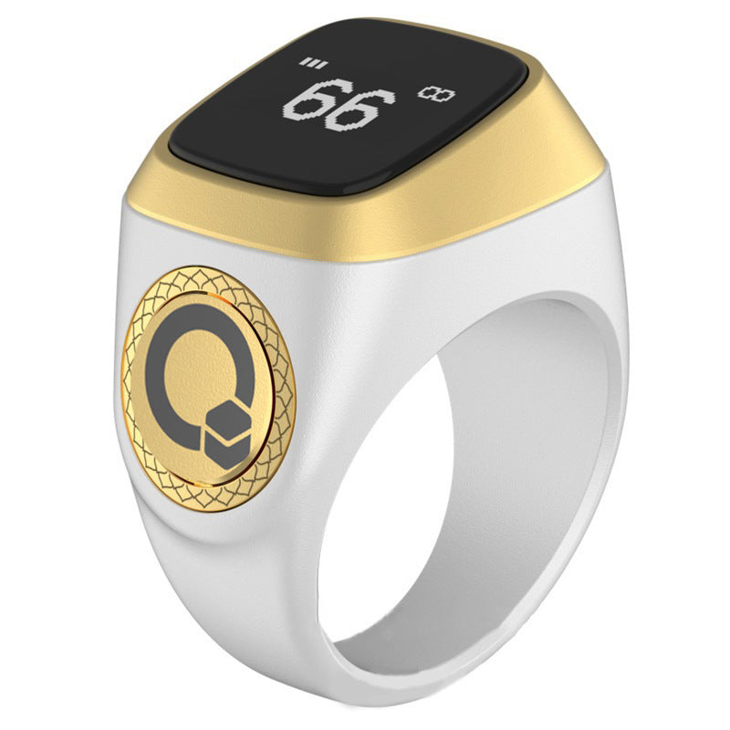 Smart ring with digital display and gold accents on a white background