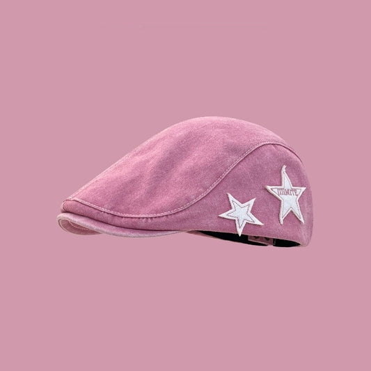 Pink cap with white stars on a pink background