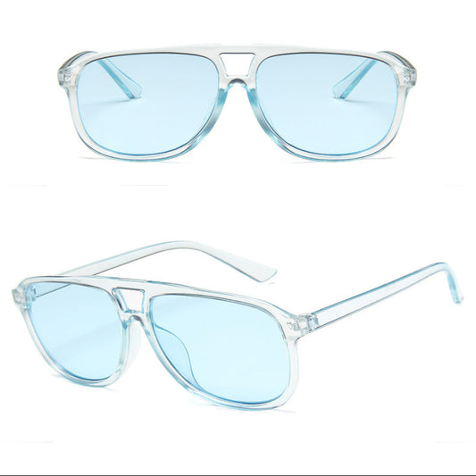 Blue sunglasses with clear frame on a white background