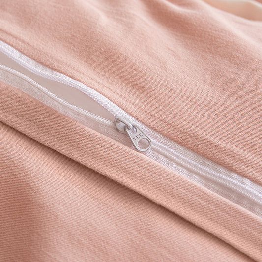 Close-up of a zipper on a pink garment.