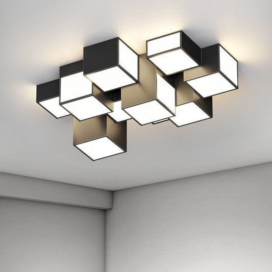 Modern ceiling light fixture with geometric design in a room.