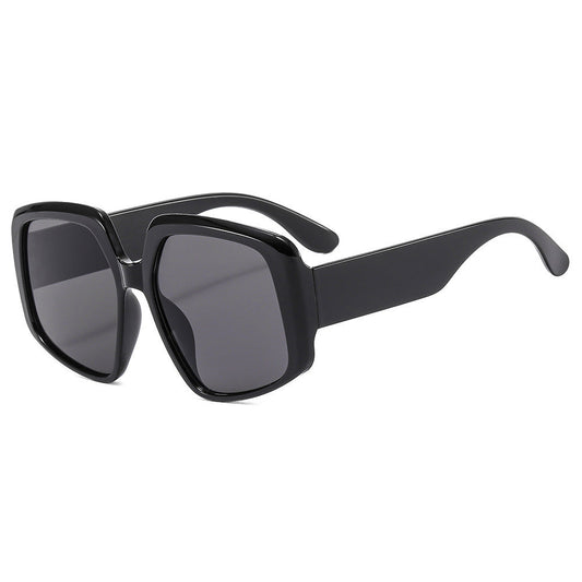 Black sunglasses with dark lenses on a white background
