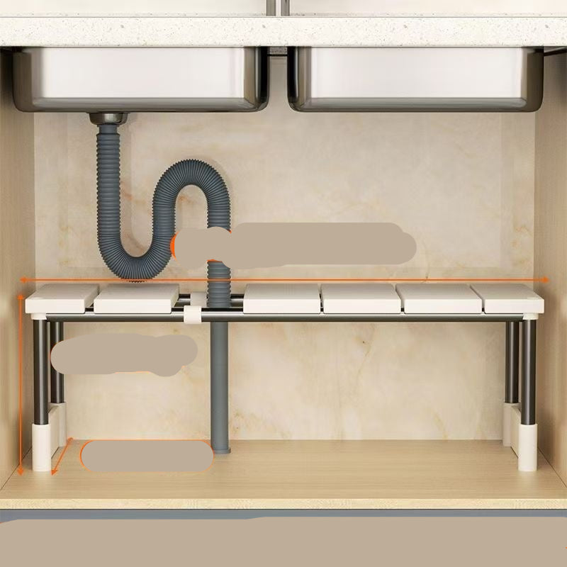 A white retractable kitchen sink storage rack with multiple shelves, containing dishes and kitchen appliances.
