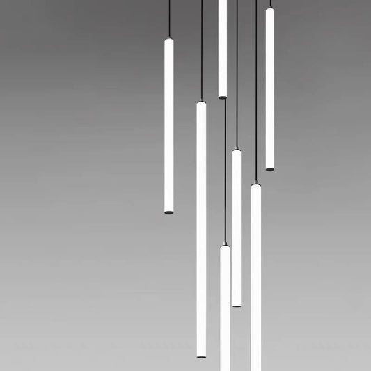 Modern pendant light fixture with cylindrical lights on a gray background