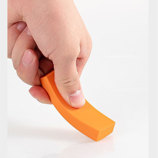 Hand holding an orange eraser on a white background