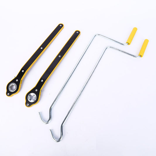 Set of metal tools with yellow handles on a white background