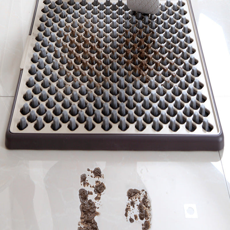 Cat litter tray with cat paw prints on a white surface