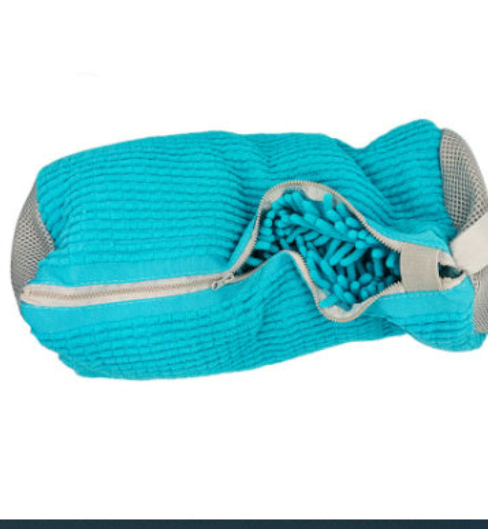 A gray and blue striped shoe bag with a zipper closure and a small white and blue label attached to it.