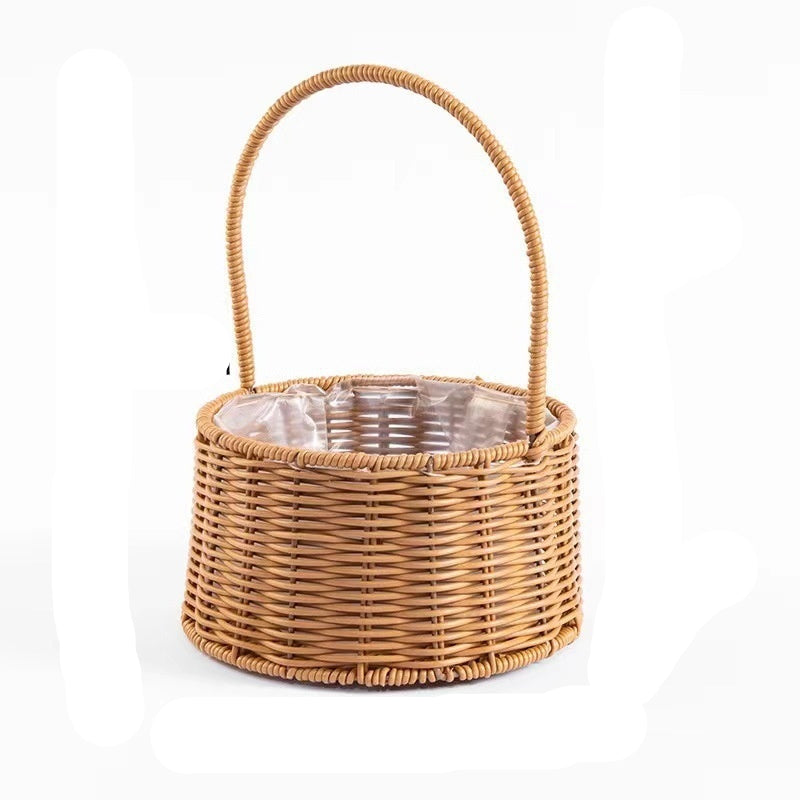 A stainless steel wire basket trolley with blue padding, mounted on a set of four caster wheels.