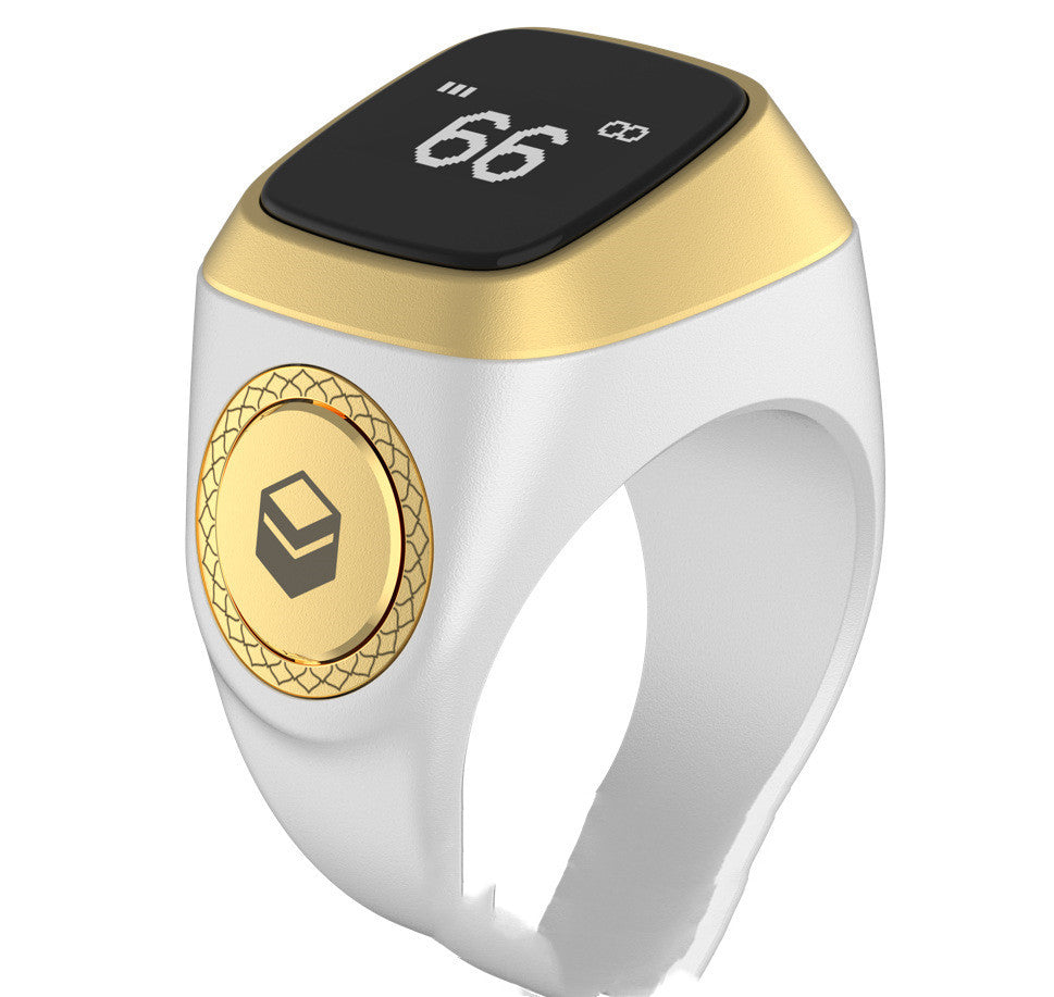 Smart ring with digital display and gold accents on a white background