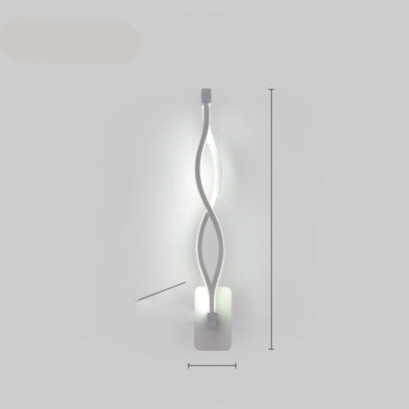 Modern wall lamp with a wavy design on a plain background.