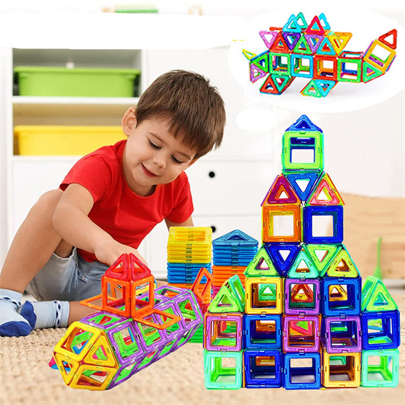 Child playing with colorful magnetic building blocks in a bright room.